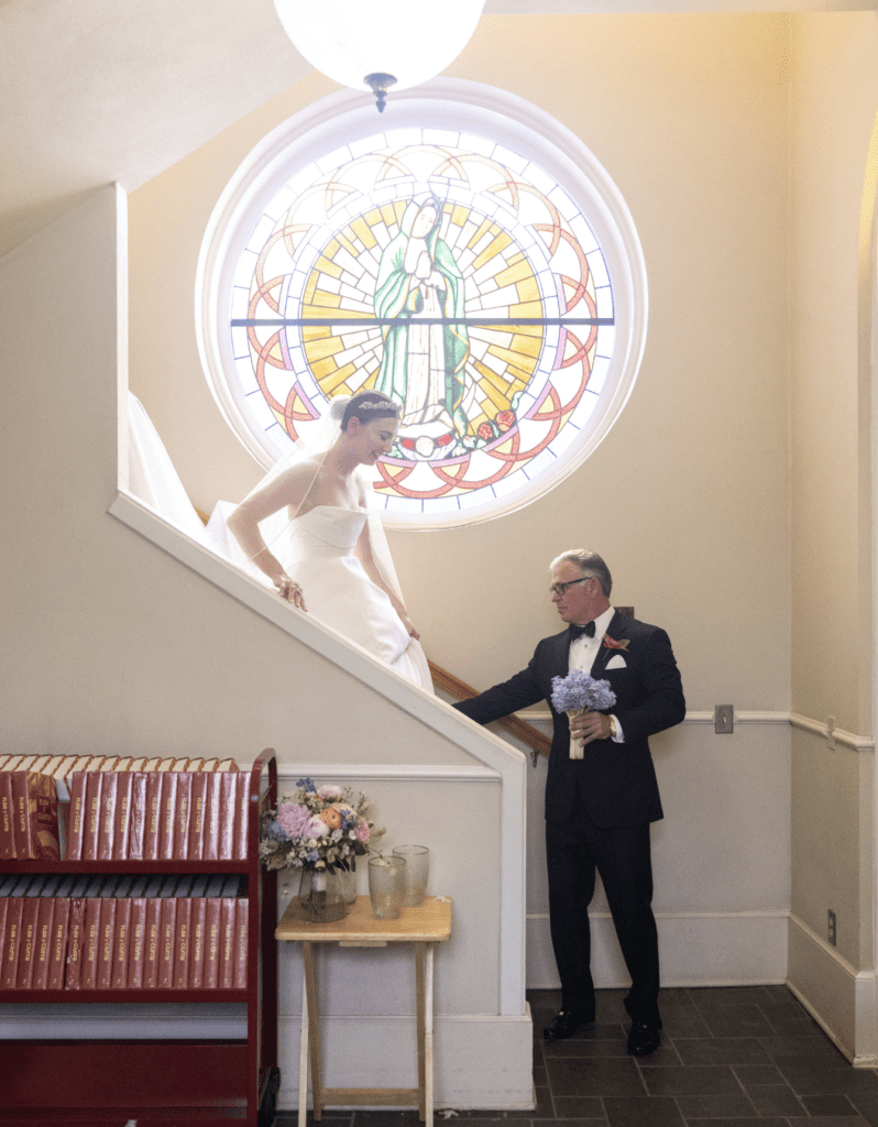 Catherine Clay and her father, Robert Clay, preparing to walk down the aisle at St. Joseph Catholic Church. (Photo by John Cain)